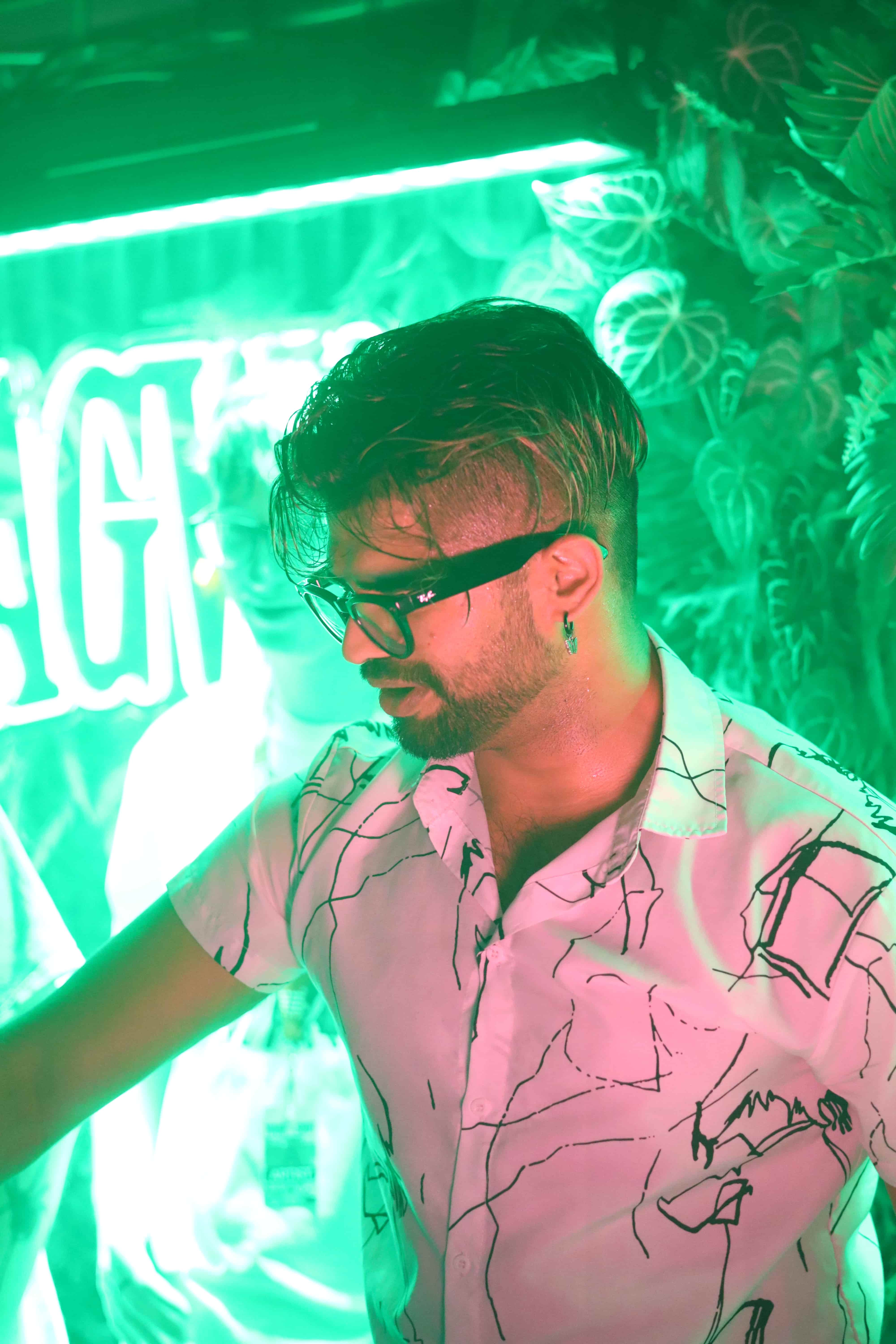 DrDarp DJing in neon green lighting